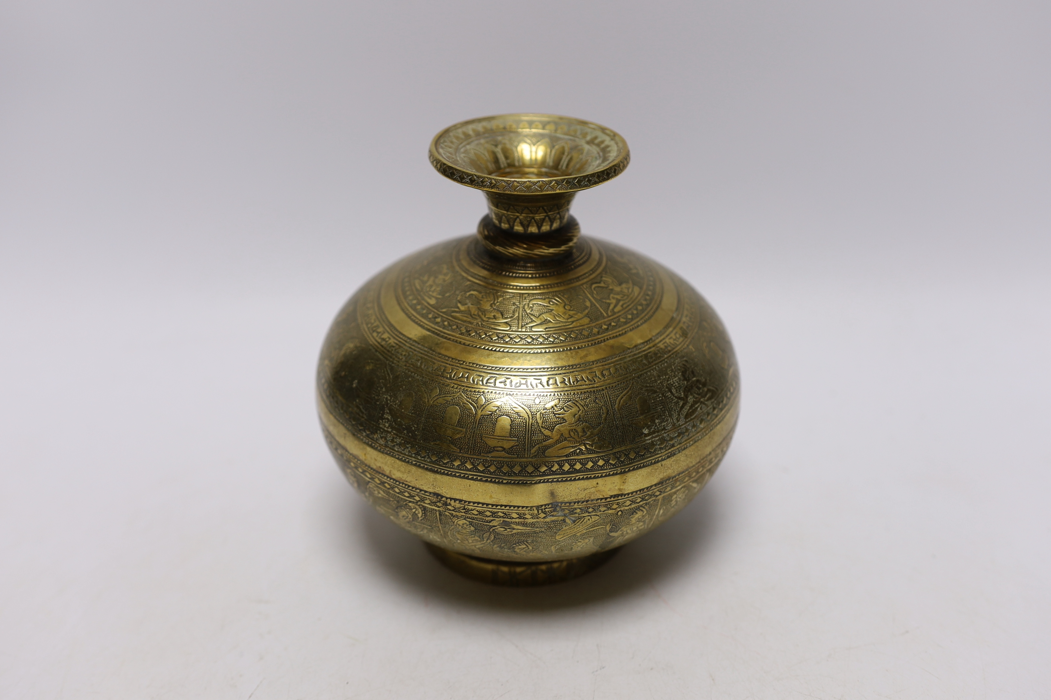 Eastern brassware to include a betel box on wheels, a vase with engraved detail and a pierced box, tallest 15.5cm (3)